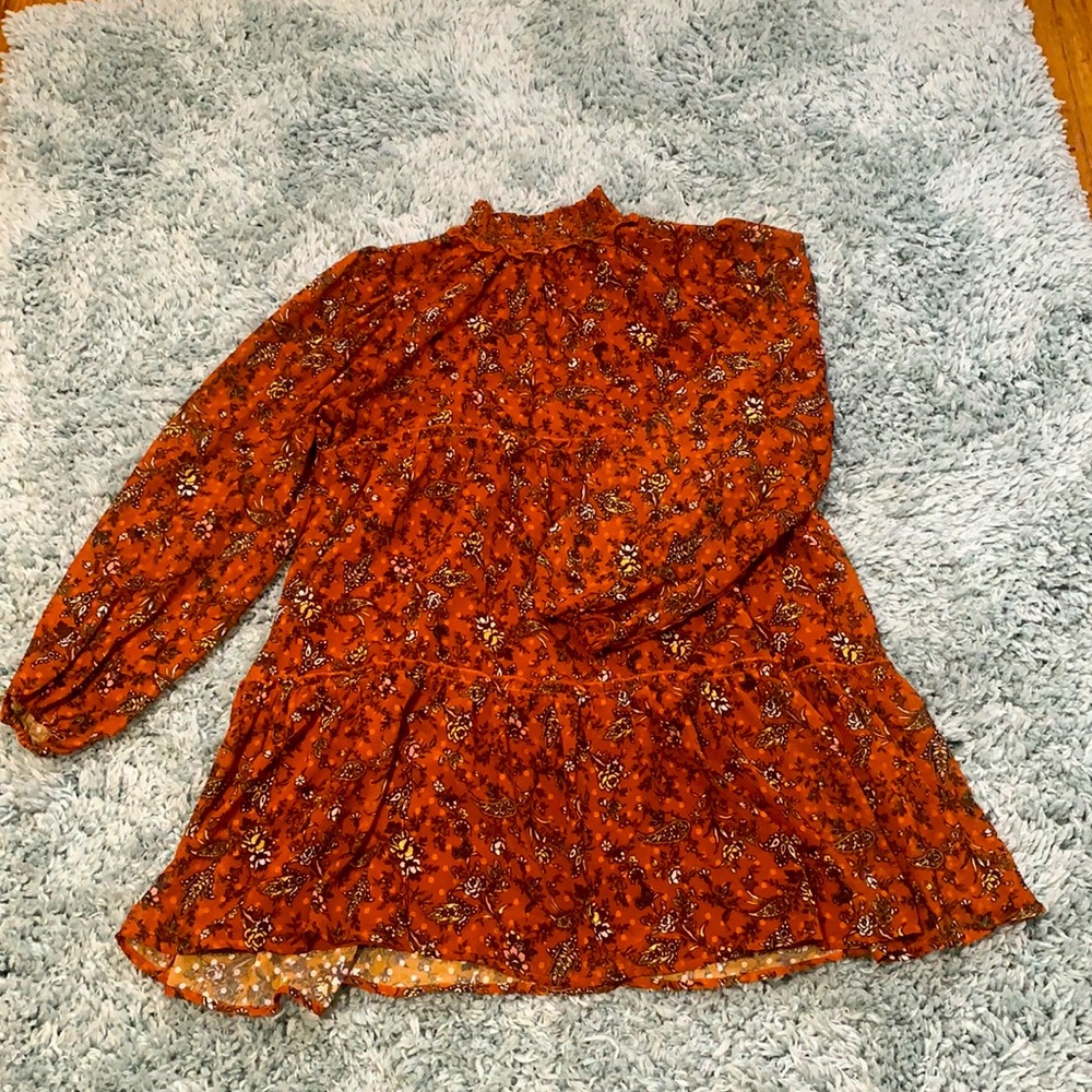 Frilly burnt orange colored knee high turtleneck dress